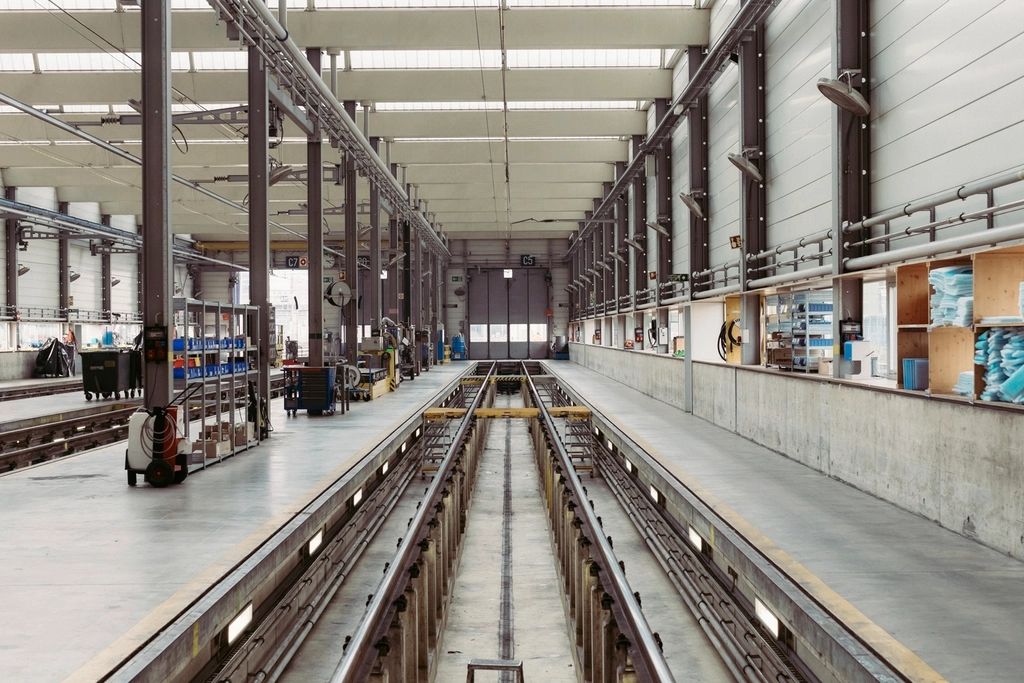 Large industrial workshop with overhead lighting